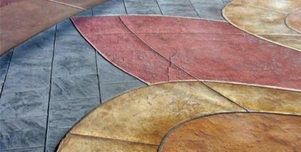 Stamped and colored concrete flooring with decorative leaf-like patterns